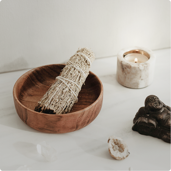 Wellness items like sage, candle, and crystals